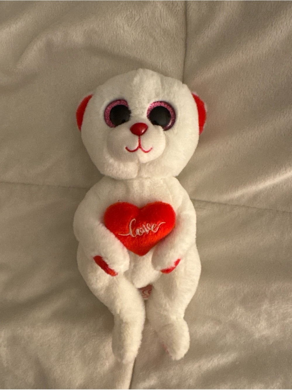 White beanie baby bear with love heart